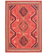 Red tribal rug with bold geometric motifs.